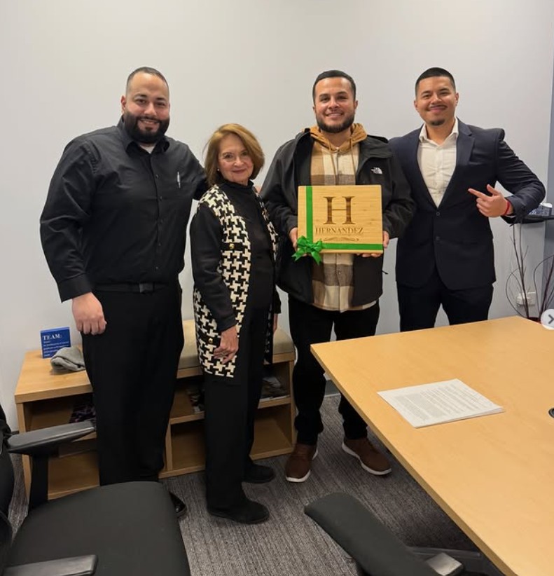 A group celebrating a home closing